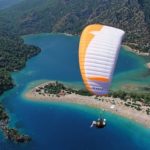 SH Paragliding over island